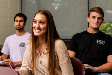 Students smiling in class